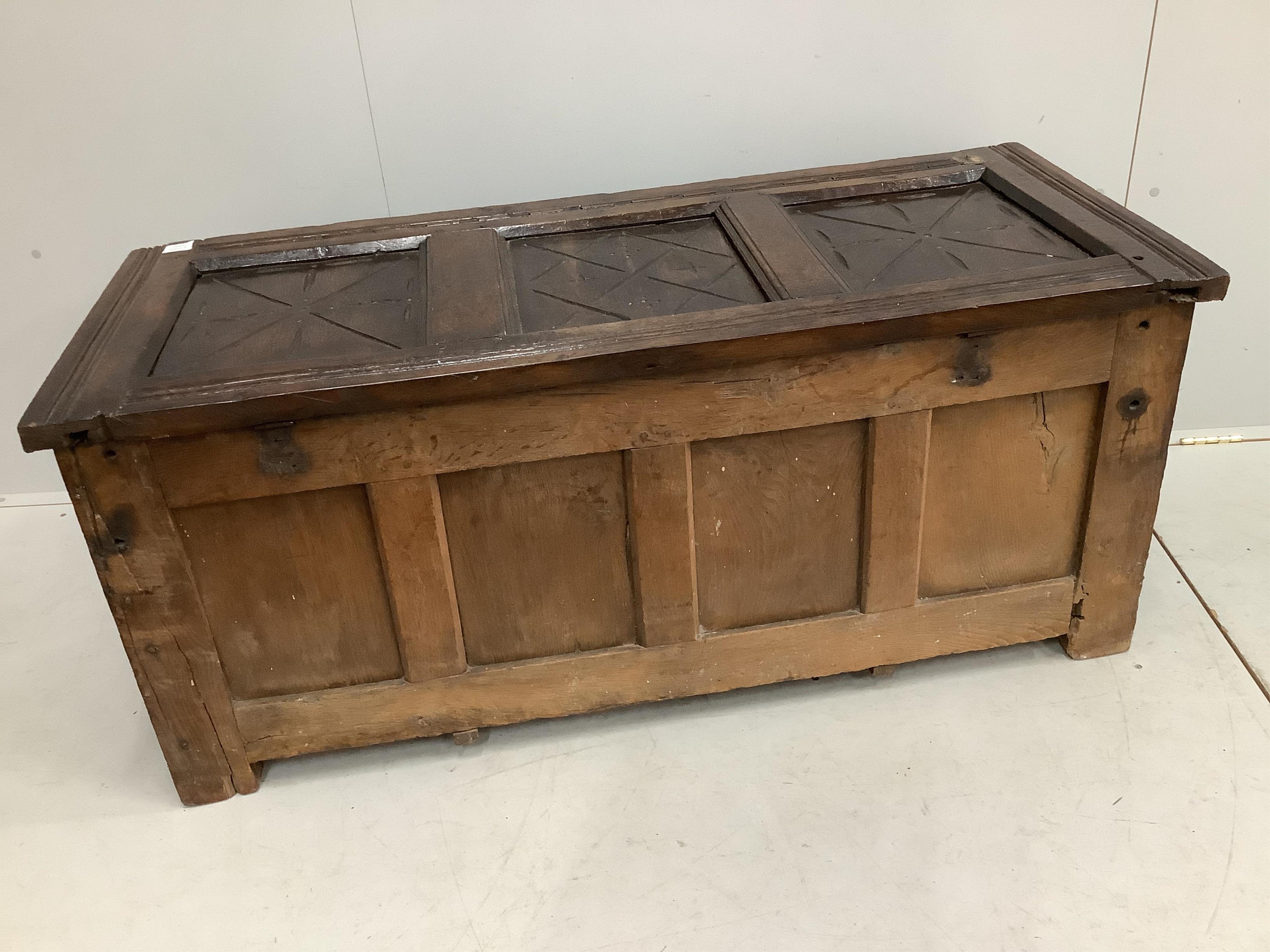 An early 18th century and later oak coffer, width 132cm, height 58cm. Condition - poor